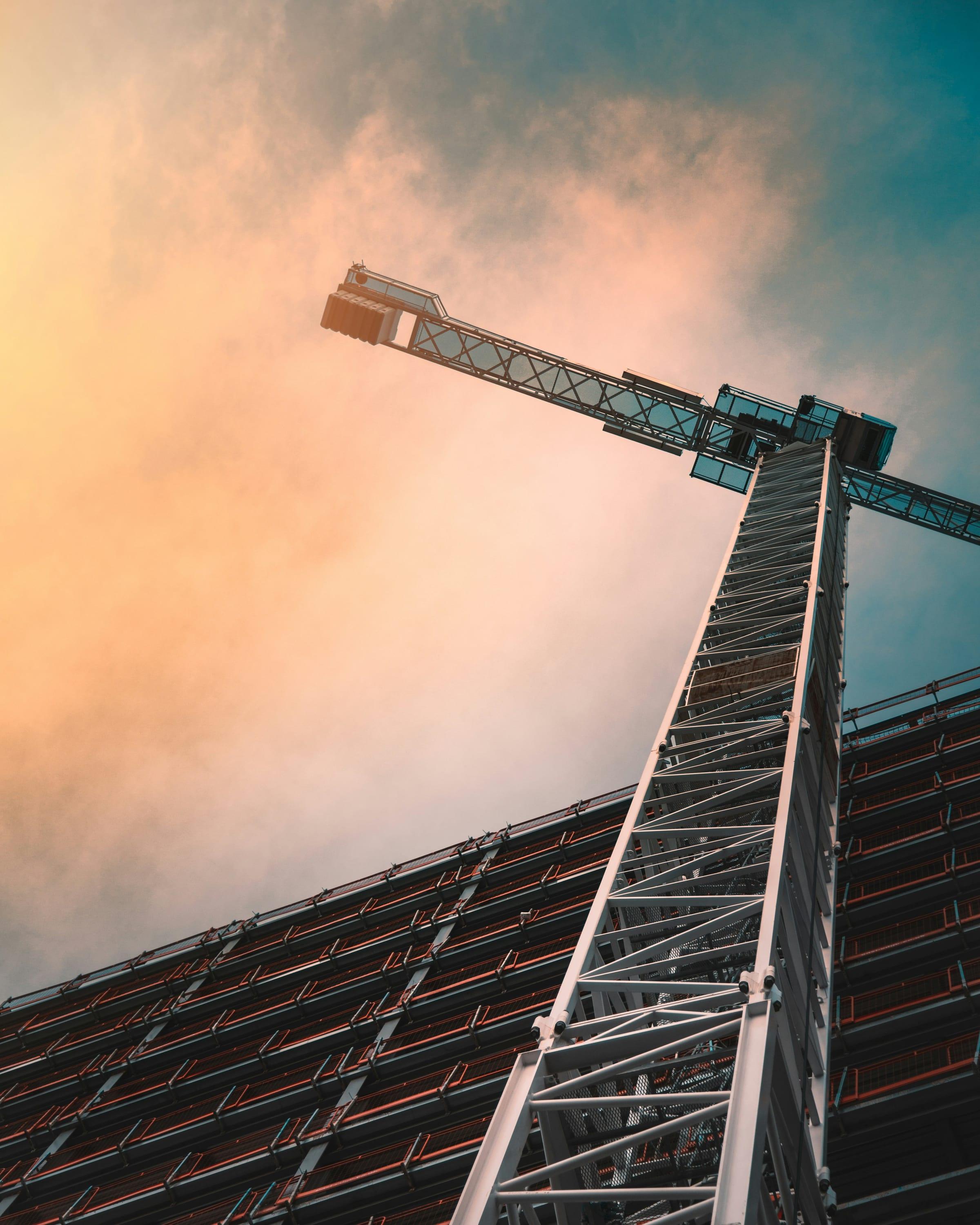 A tower crane against an evening sky.