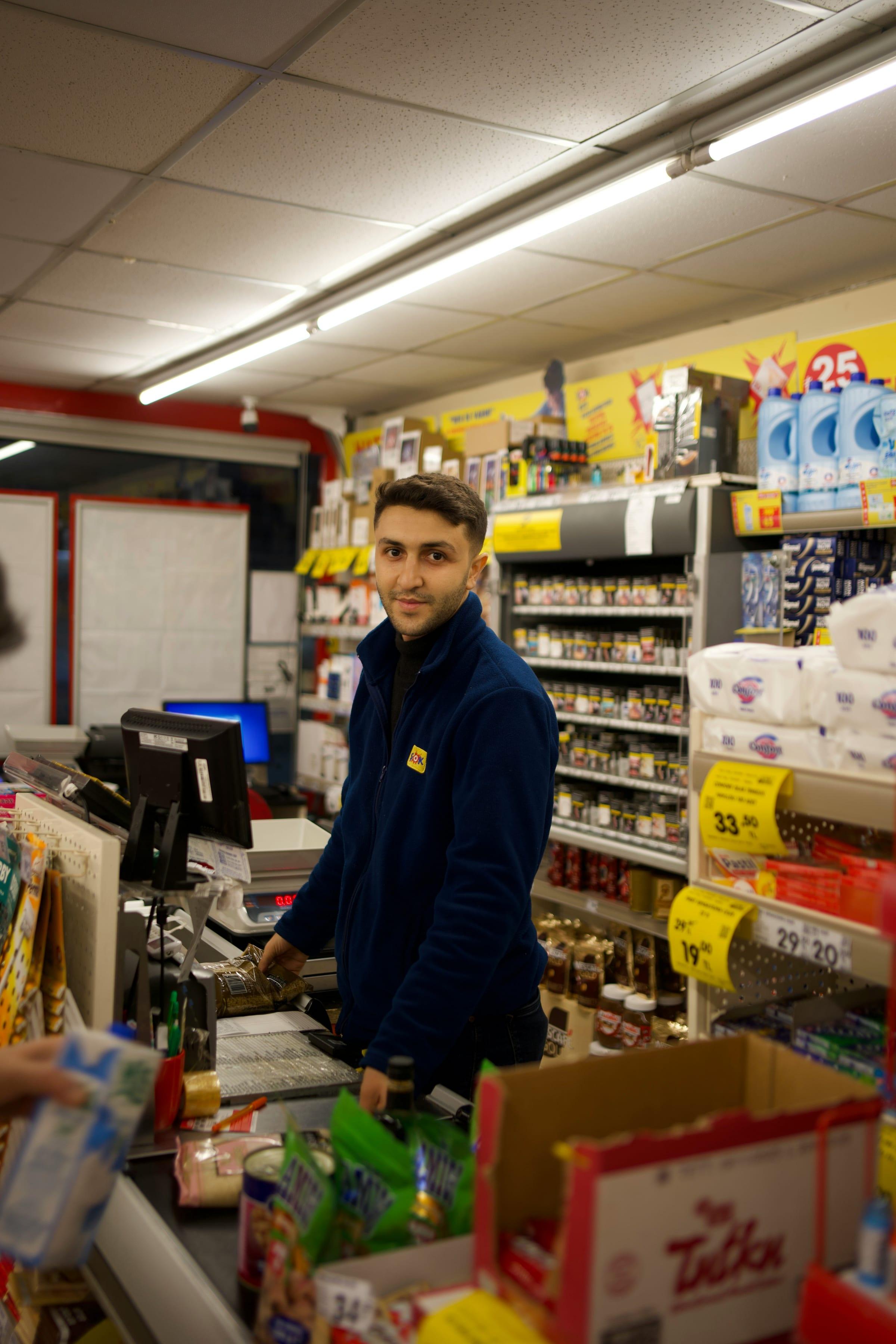 A checkout operator at a supermarket till.